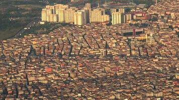 Aerial view of buildings in crowded city of Jakarta cityscape from airplane video