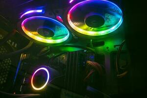 Vibrant neon lights showing the inside of a pc with graphics cards. photo