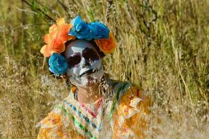 In Mexico, people celebrate the Day of the Dead in colorful costumes photo