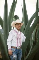 Mexican cowboy, agave plants, nature beauty, sunglasses, toddler, captivating landscape photo