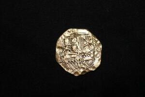 Gold And Silver Coins Laid Out on Display. photo