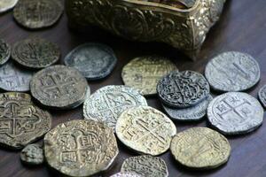 Gold And Silver Coins Laid Out on Display. photo