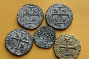 Gold And Silver Coins Laid Out on Display. photo