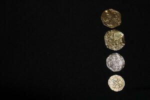Gold And Silver Coins Laid Out on Display. photo