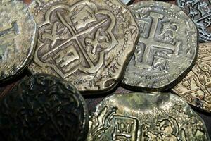 Gold And Silver Coins Laid Out on Display. photo