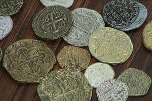 Gold And Silver Coins Laid Out on Display. photo