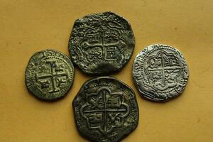 Gold And Silver Coins Laid Out on Display. photo