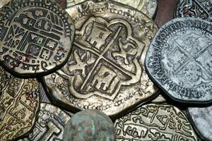 Gold And Silver Coins Laid Out on Display. photo