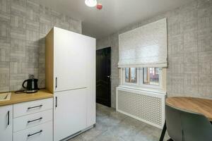 interior of modern luxure kitchen  in studio apartments with cupboard photo
