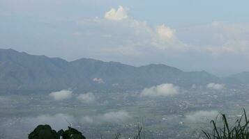 View of the mountains from the top of the hill photo