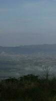 View of the mountains from the top of the hill photo