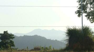 View of the mountains from the top of the hill photo