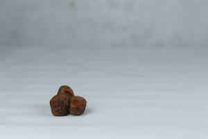 Pile of tasty dry dates isolated on white background photo