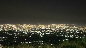 Night view of the city from the top of the hill photo