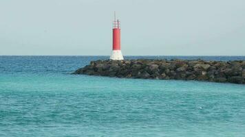 Navigation beacon on a stone breakwater. video