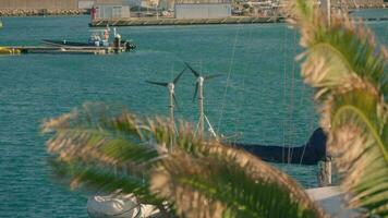 Strong wind in sea marinas, wind turbines on yachts. video