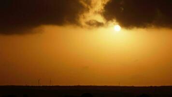 A beautiful sunset in the desert with the sun breaking through the clouds. video