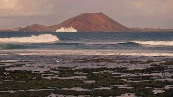 The waves crash against the stone shore video