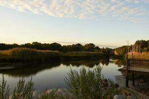 Jones River Views at Dawn with Sun Reflecting photo