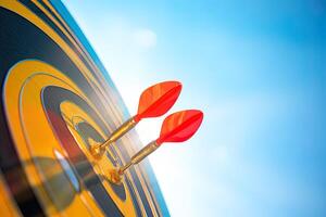 red darts arrows in the target center on blue sky background. Business target and success concept. photo