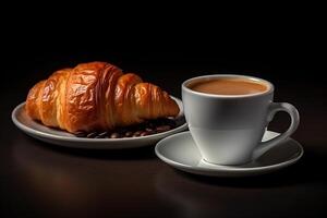 cup of coffee and croissants isolated on a black background. photo