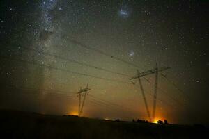 High voltage power line in a nocturnal landscape, La Pampa, Patagonia, Argentina. photo