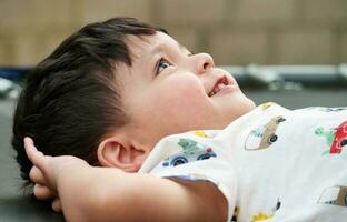 Beautiful Close up Portrait of an Asian Pakistani Baby Boy Named Ahmed Mustafain Haider is Posing at Home Garden at Saint Augustine Ave Luton, England UK. Image Was Captured on April 03rd, 2023. photo