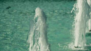 Fountain jets in slow motion, blue water. video