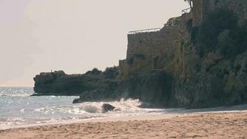A majestic ocean view from a rocky cliff on a serene beach video