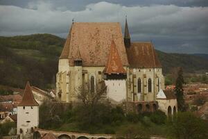 Biertan a very beautiful medieval village in Transylvania, Romania. A historical town in Romania that has preserved the Frankish and Gothic architectural style. Travel photo. photo