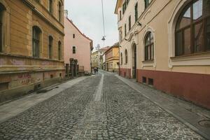 Medieval street with historical buildings in the heart of Romania. Sibiu the eastern European citadel city. Travel in Europe photo