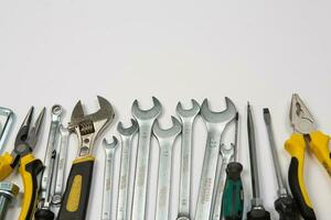 Set of tools for repair in a case on a white background. Assorted work or construction tools. Wrenches, Pliers, screwdriver. Top view photo