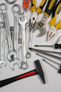 Set of tools for repair in a case on a white background. Assorted work or construction tools. Wrenches, Pliers, screwdriver. Top view photo