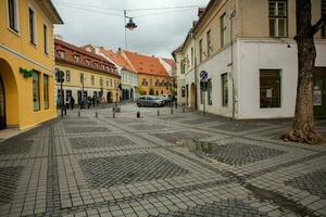 Medieval street with historical buildings in the heart of Romania. Sibiu the eastern European citadel city. Travel in Europe photo