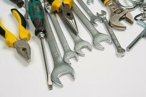 Set of tools for repair in a case on a white background. Assorted work or construction tools. Wrenches, Pliers, screwdriver. Top view photo