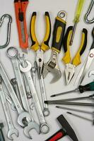 Set of tools for repair in a case on a white background. Assorted work or construction tools. Wrenches, Pliers, screwdriver. Top view photo