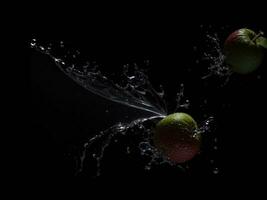 Photo blender with fruits flying isolated on black background fruits juice and splash