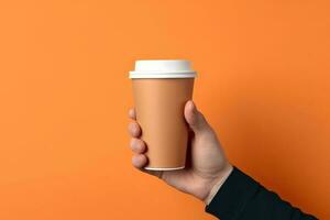 Generative AI illustration of paper coffee cup in a hand, isolated orange background photo