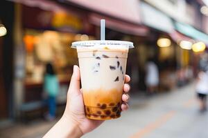 Generative AI illustration of hand holding Taiwan milk tea and blurry background photo