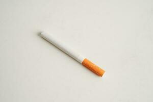 Cigarette, roll tobacco in paper with filter tube, No smoking concept. photo