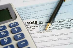 Tax form 1040 U.S. Individual Income Tax Return, business finance concept. photo