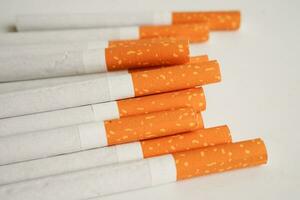 Cigarette, roll tobacco in paper with filter tube, No smoking concept. photo