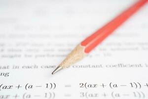 Pencil on mathematic formula exercise test paper in education school. photo