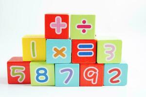 Number wood block cubes for learning Mathematic, education math concept. photo