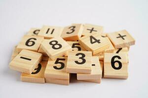 Number wood block cubes for learning Mathematic, education math concept. photo