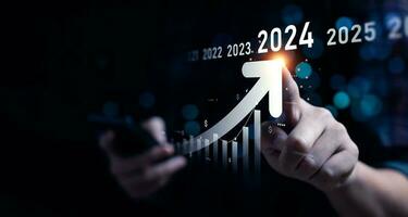 Business growing in 2024. analytical businessman planning business growth 2024, strategy digital marketing, profit income, economy, stock market trends and business, technical analysis strategy photo