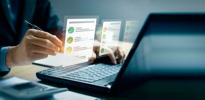Business performance checklist, businessman using laptop doing online checklist survey, Check marks on checklist and Filling online form or answering questions. evaluation, online survey, online exam. photo