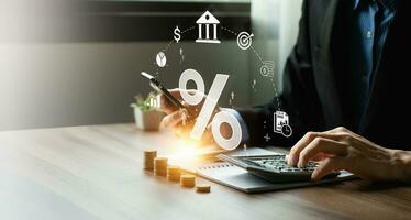 Interest rates, cost of borrowing money, return on investments. Business is calculating revenue or profit and return on investment as a percentage. investing, and financial decision making. photo