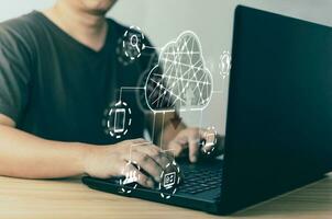 man use laptop and cloud computing diagram show on screen.Data storage.the use of online digital network technology in business, buying and selling commerce online digital marketplace photo
