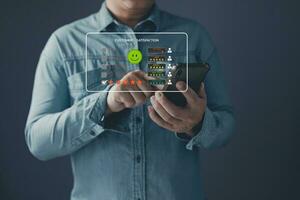 a client use smartphone select on the five star to give satisfaction in service.rating very impressed.Customer service and Satisfaction concept. photo